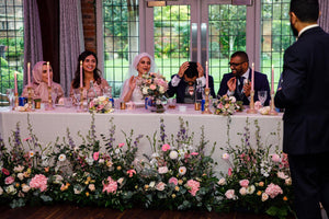 Top table decorated with flowers and candles